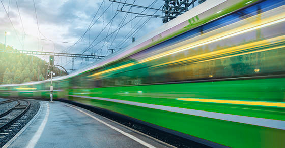 A fast-moving train speeding down the tracks, symbolizing getting a business back on track after tax problems
